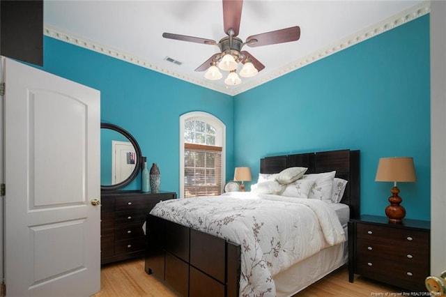 bedroom with ceiling fan and light wood-type flooring