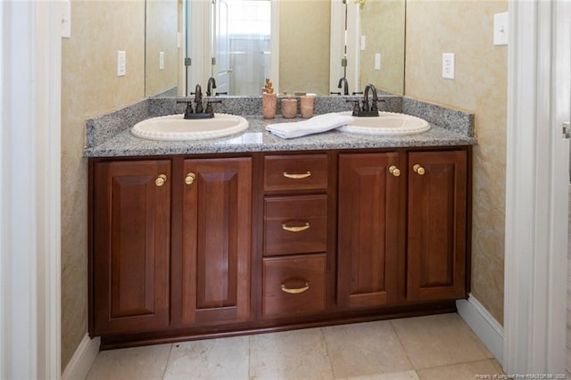 5304 Pineview Rd, Lumberton, NC 28360 - bathroom featuring double vanity and wallpapered walls