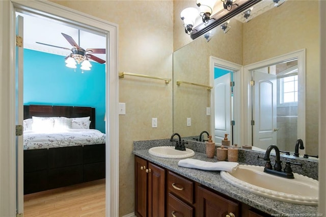 5304 Pineview Rd, Lumberton, NC 28360 - bathroom featuring double vanity, a ceiling fan, and wood finished floors