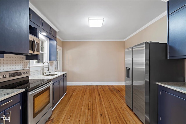 kitchen with sink, crown molding, light hardwood / wood-style floors, and appliances with stainless steel finishes