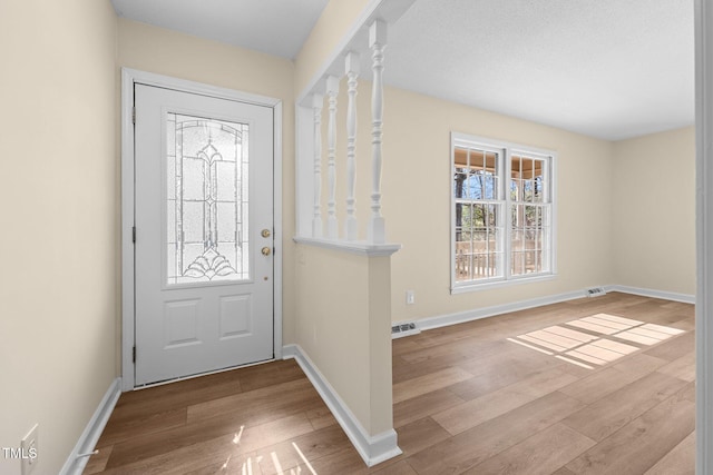 foyer with light hardwood / wood-style floors