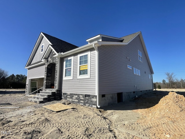 view of home's exterior featuring crawl space