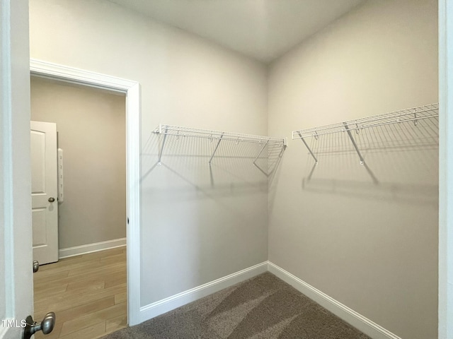 82 N Stagecoach Dr, Wendell, NC 27591 - walk in closet featuring wood finished floors