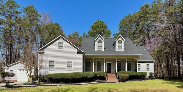 2934 Appaloosa Ct, Graham, NC 27253 - new england style home with an outbuilding, covered porch, a front lawn, and a detached garage