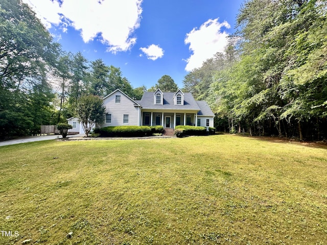 2934 Appaloosa Ct, Graham, NC 27253 - cape cod-style house with covered porch and a front yard