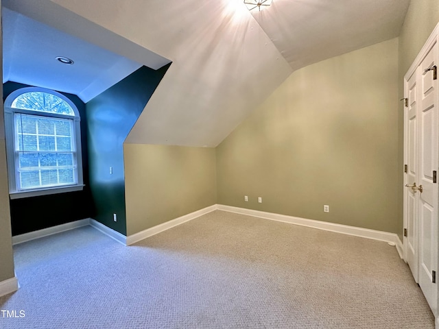 2934 Appaloosa Ct, Graham, NC 27253 - additional living space with lofted ceiling, carpet, and baseboards