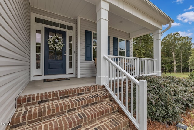 doorway to property with a porch