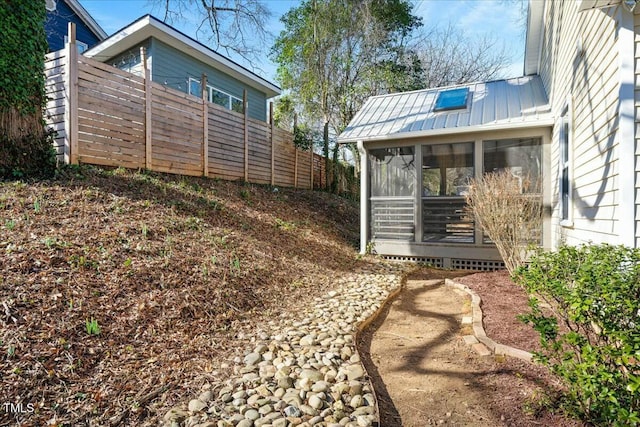 view of yard featuring a sunroom