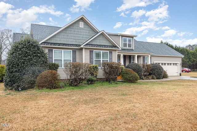 view of front of house featuring a garage and a front yard