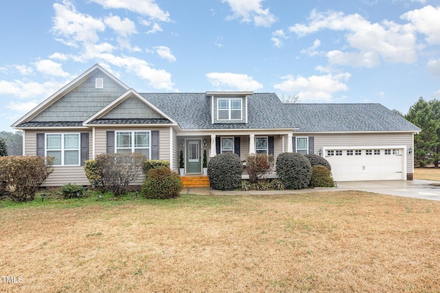 view of front facade with a garage and a front lawn