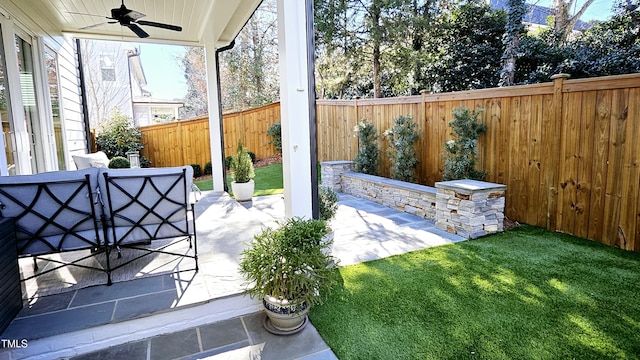 view of patio with a ceiling fan and a fenced backyard