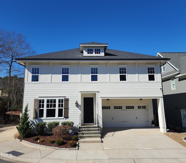 view of front of house featuring a garage and concrete driveway