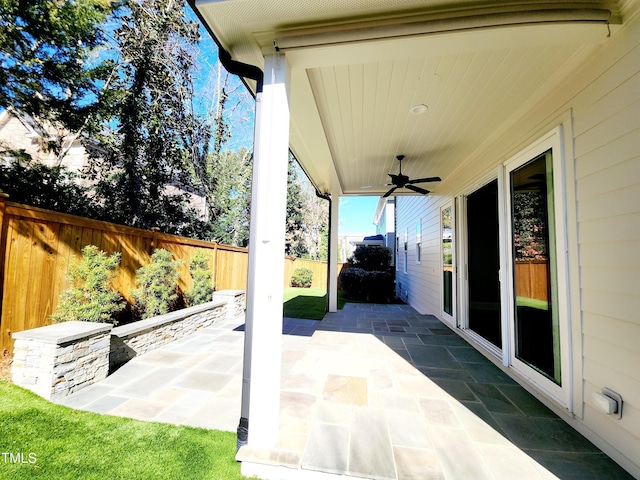 view of patio / terrace with a ceiling fan and a fenced backyard