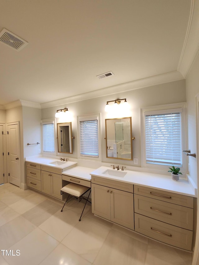 bathroom featuring two vanities, visible vents, and a sink