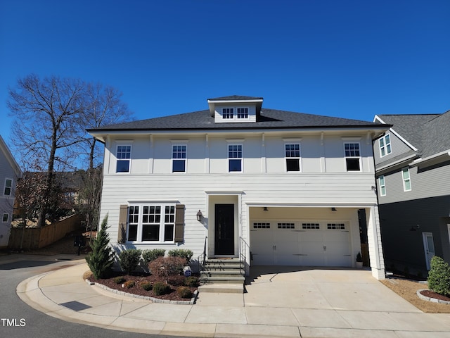 view of front facade with driveway and an attached garage