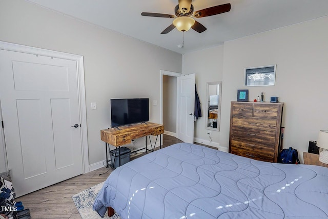 bedroom featuring hardwood / wood-style floors and ceiling fan