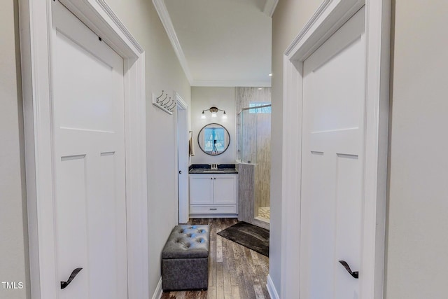 bathroom with a shower, wood-type flooring, vanity, and crown molding