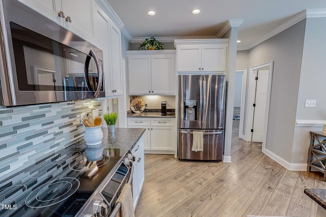 kitchen with white cabinetry, light hardwood / wood-style flooring, and appliances with stainless steel finishes