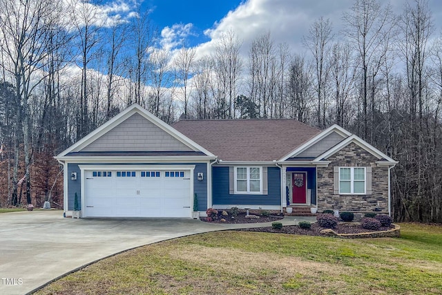 view of front of property with a garage and a front yard