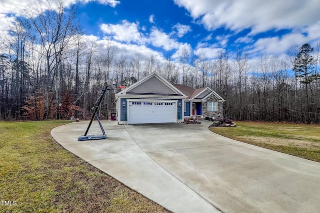 view of front facade with a garage and a front yard