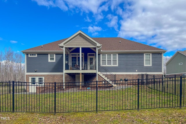 rear view of property with a yard and french doors