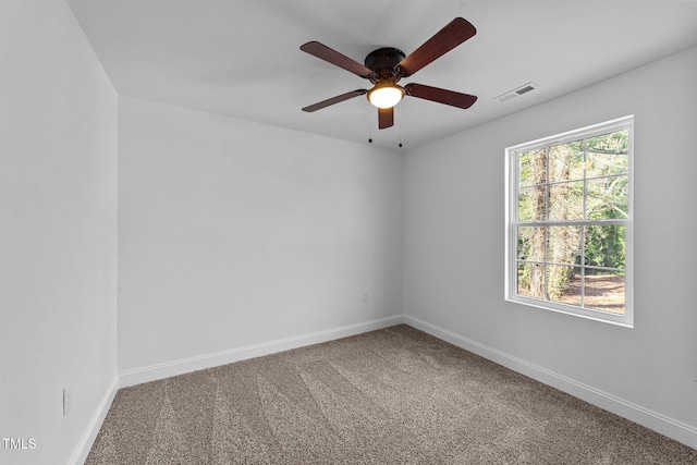 unfurnished room featuring carpet and ceiling fan