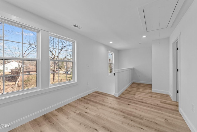 empty room with light hardwood / wood-style floors