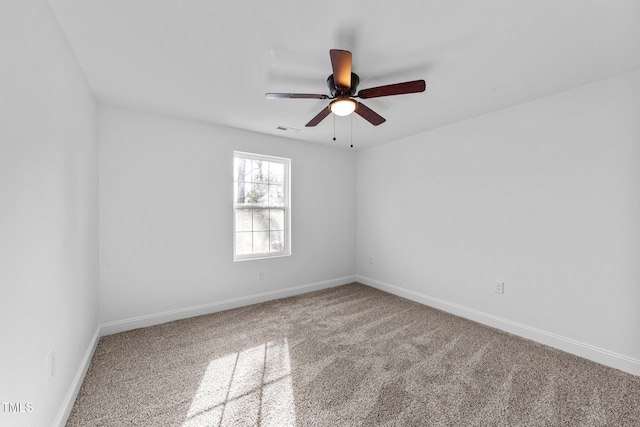 empty room featuring ceiling fan and carpet flooring