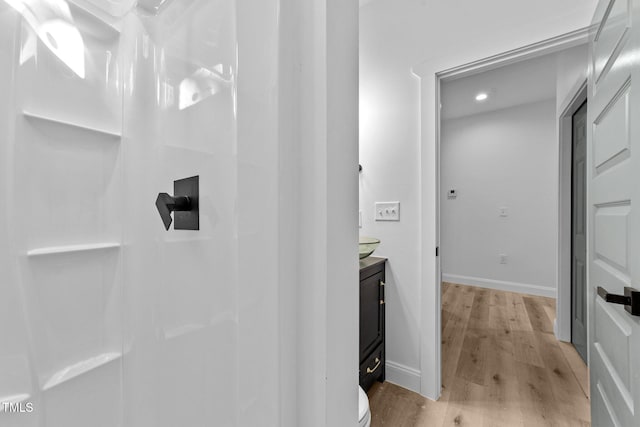 bathroom with vanity and wood-type flooring