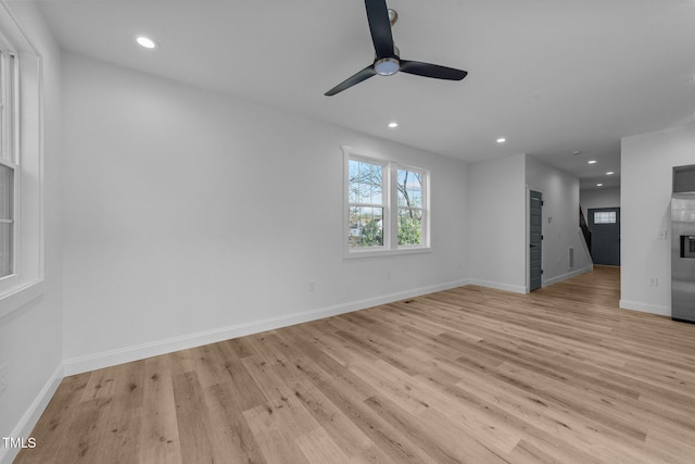 unfurnished living room featuring light hardwood / wood-style floors and ceiling fan