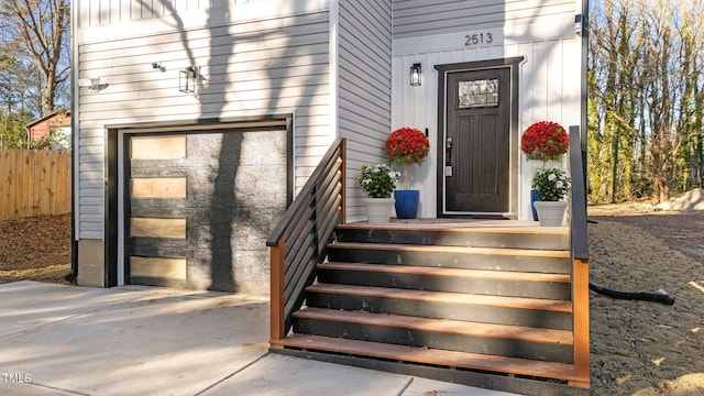 view of exterior entry with a garage