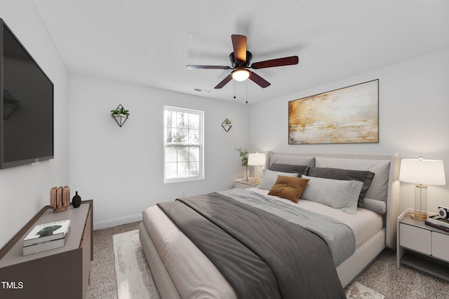 bedroom with light carpet and ceiling fan