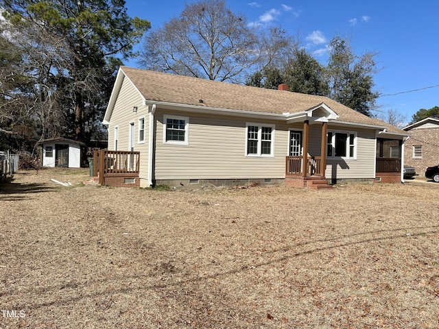 view of front of house featuring a storage unit