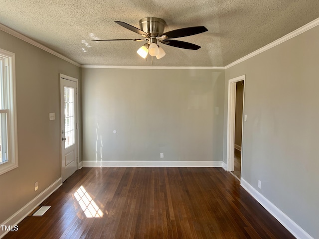 unfurnished room with ceiling fan, dark wood-type flooring, ornamental molding, and a textured ceiling