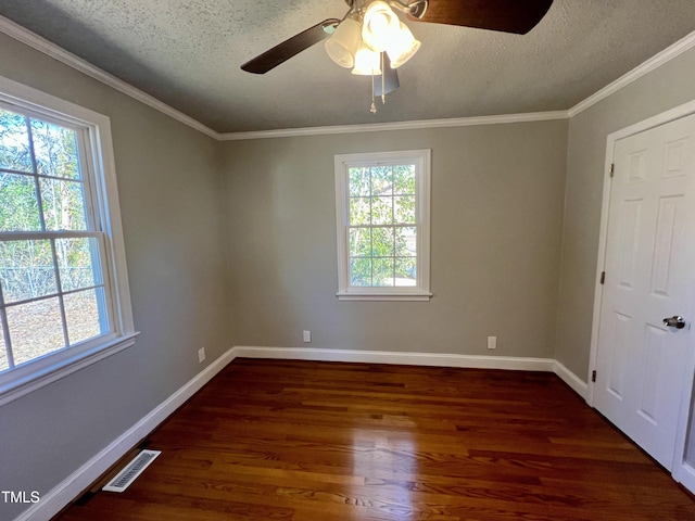 unfurnished room with ornamental molding, ceiling fan, a textured ceiling, and dark hardwood / wood-style flooring