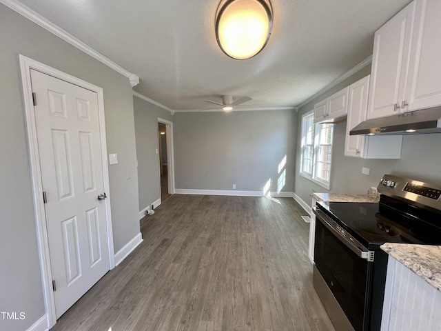 kitchen with white cabinetry, stainless steel range with electric cooktop, hardwood / wood-style flooring, ornamental molding, and ceiling fan