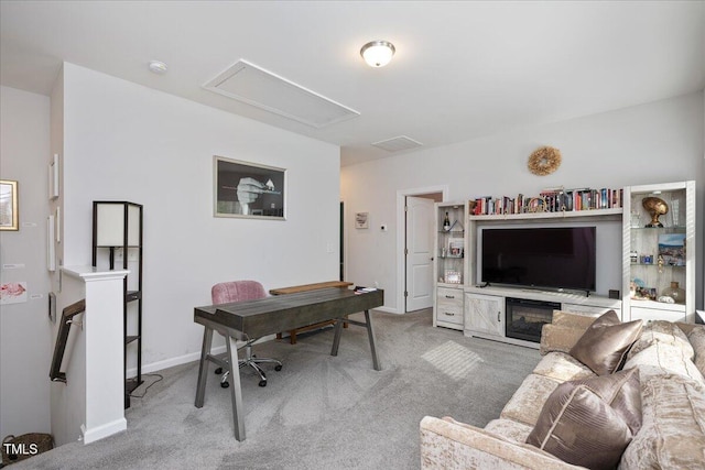 living room featuring visible vents, light carpet, and baseboards