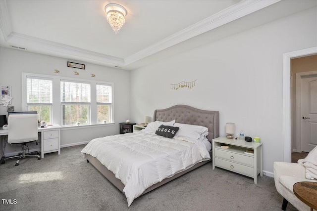 bedroom with carpet, baseboards, visible vents, a tray ceiling, and crown molding