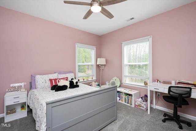 bedroom with carpet, baseboards, visible vents, and ceiling fan