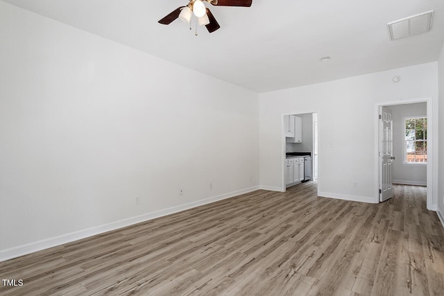 unfurnished living room featuring ceiling fan and light hardwood / wood-style flooring