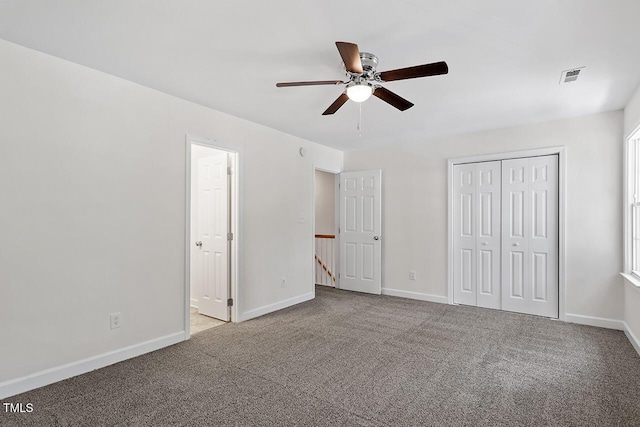 unfurnished bedroom featuring ceiling fan, light colored carpet, and a closet