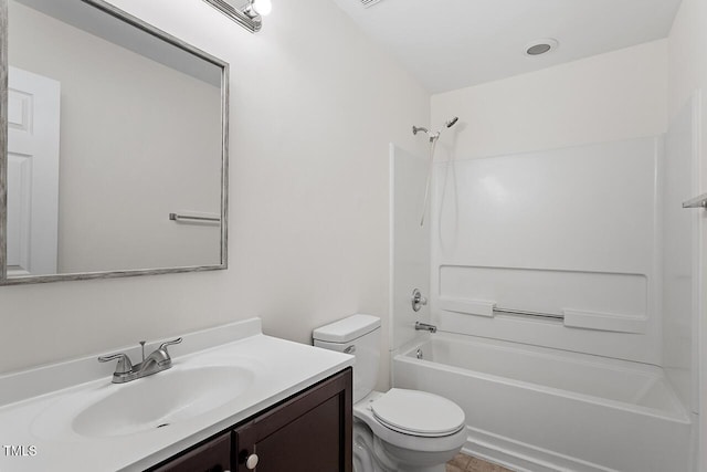 full bathroom featuring vanity, bathtub / shower combination, and toilet