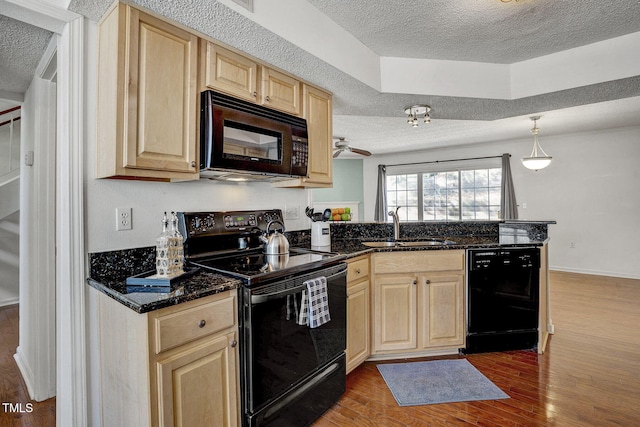 kitchen with sink, dark wood-type flooring, a textured ceiling, and black appliances