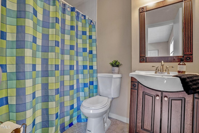 bathroom featuring a shower with curtain, vanity, tile patterned floors, and toilet