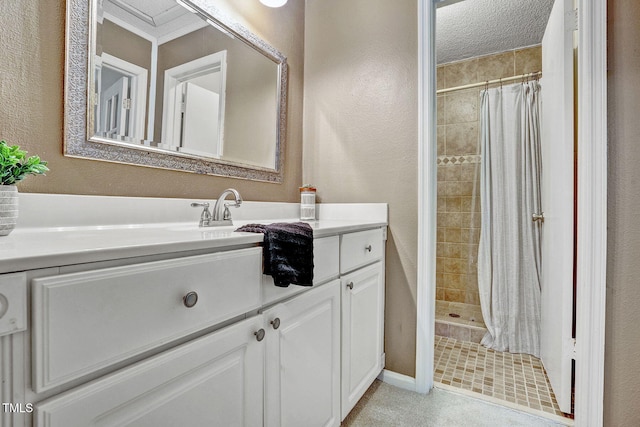 bathroom with walk in shower, vanity, tile patterned flooring, and a textured ceiling