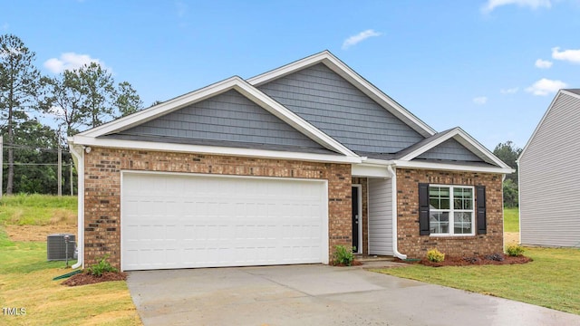 craftsman inspired home with central AC, a garage, and a front lawn