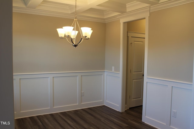 unfurnished room with dark wood-type flooring, coffered ceiling, crown molding, a chandelier, and beam ceiling