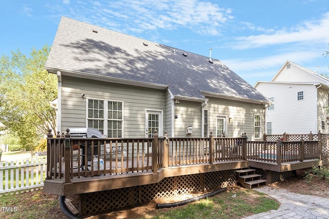 back of house featuring a deck