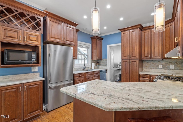 kitchen featuring decorative light fixtures, light stone countertops, light hardwood / wood-style floors, and black appliances