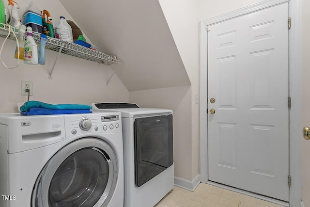 clothes washing area featuring washer and dryer